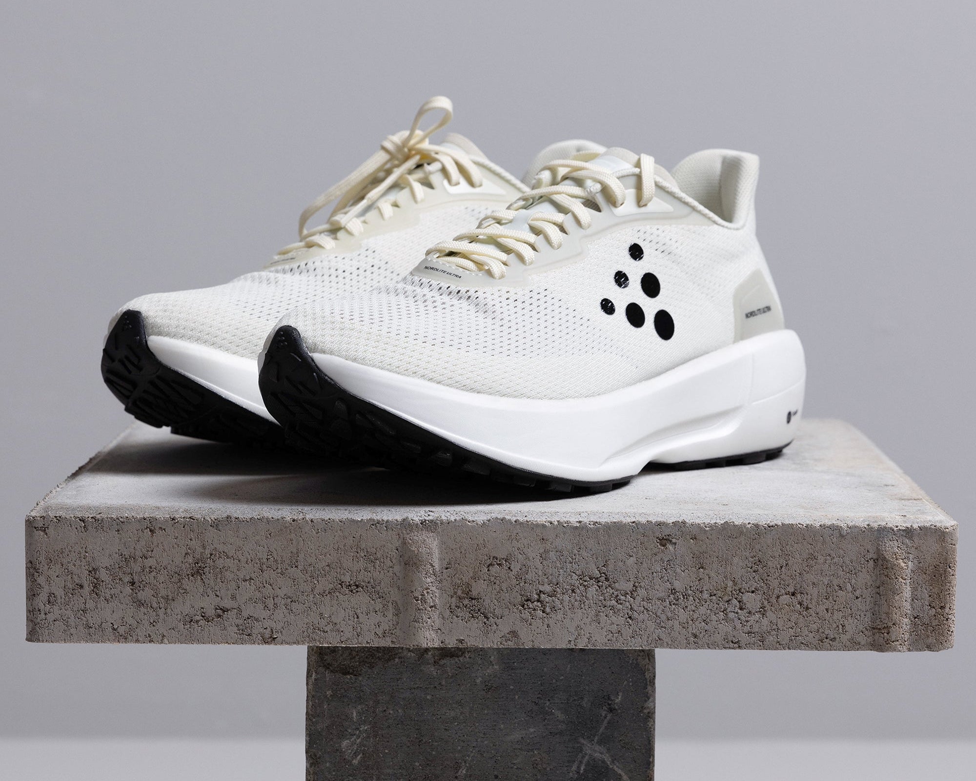 White running shoes on table