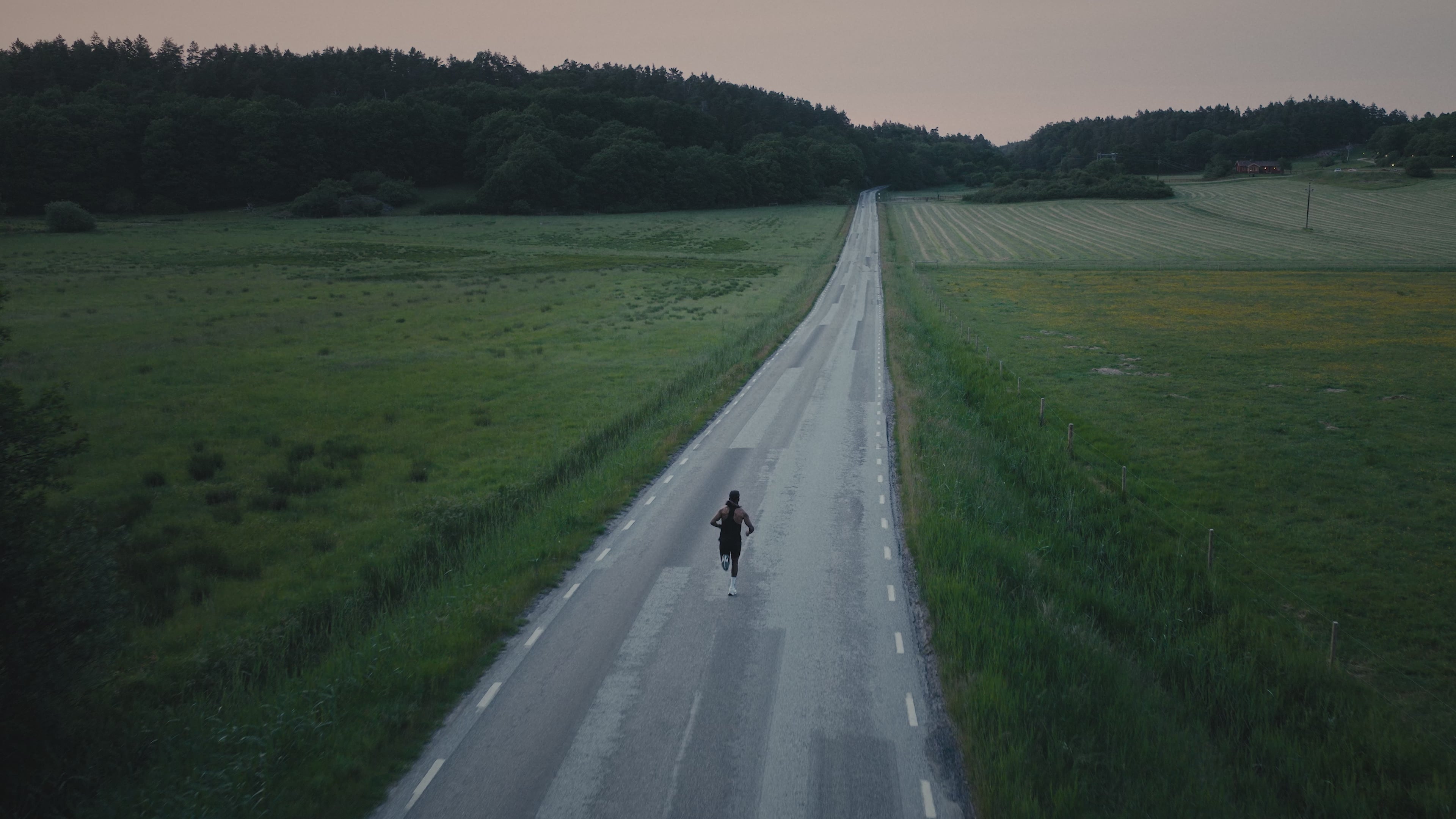 Man running on open road